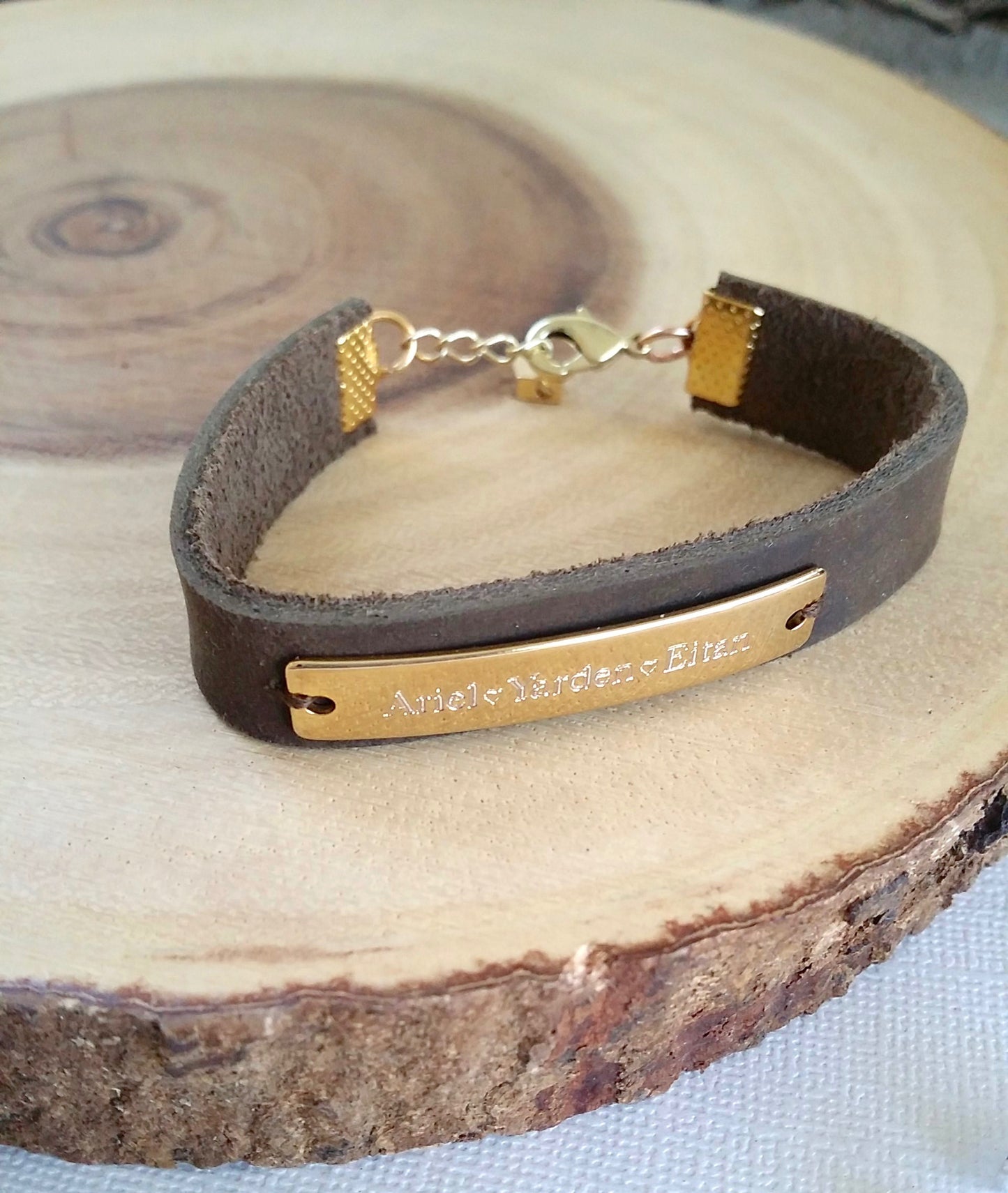 Customized engraving on rose gold cuff bracelet with black/brown leather