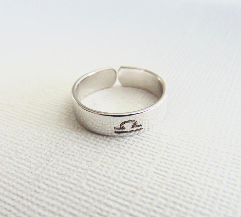 Stackable ring engraved with Child's Name or message. Adjustable band