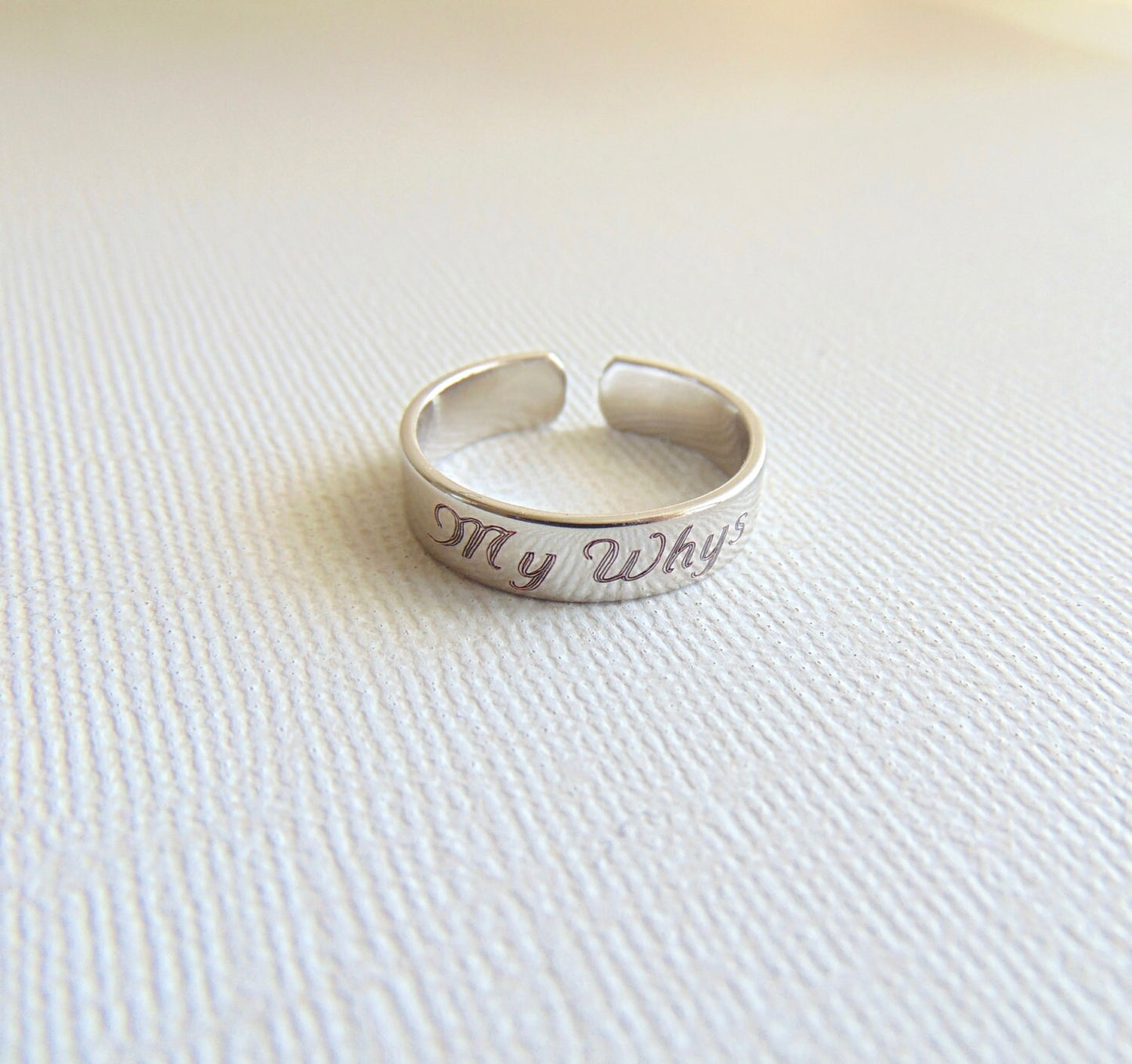 Stackable ring engraved with Child's Name or message. Adjustable band