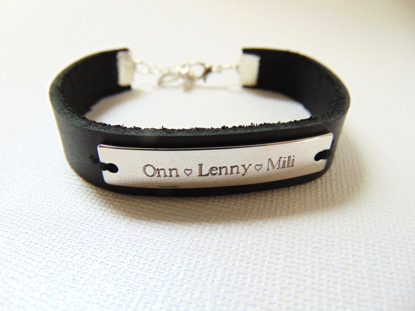 Customized engraving on rose gold cuff bracelet with black/brown leather