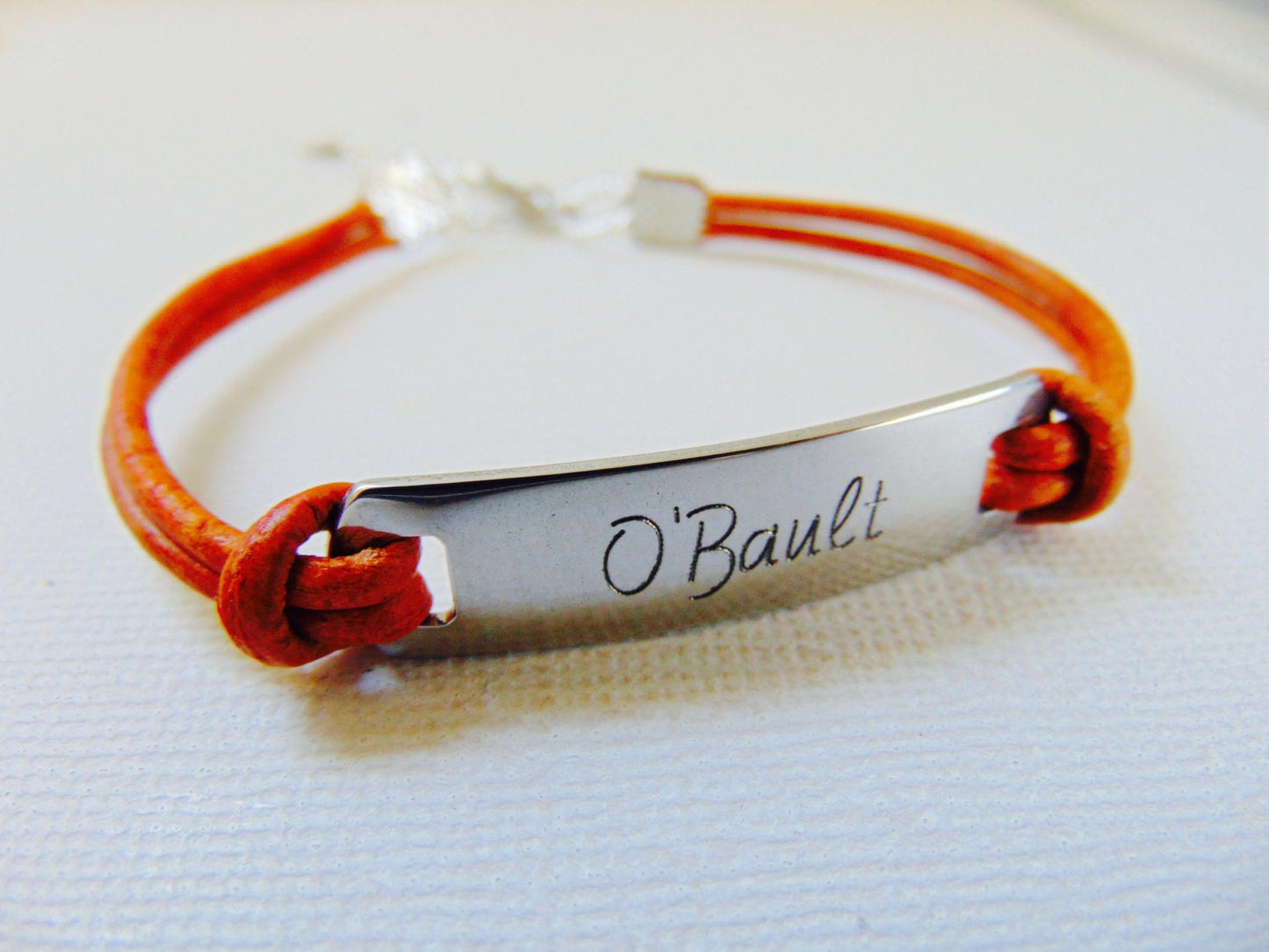Personalized Engraved message on a bar bracelet and brown/black leather