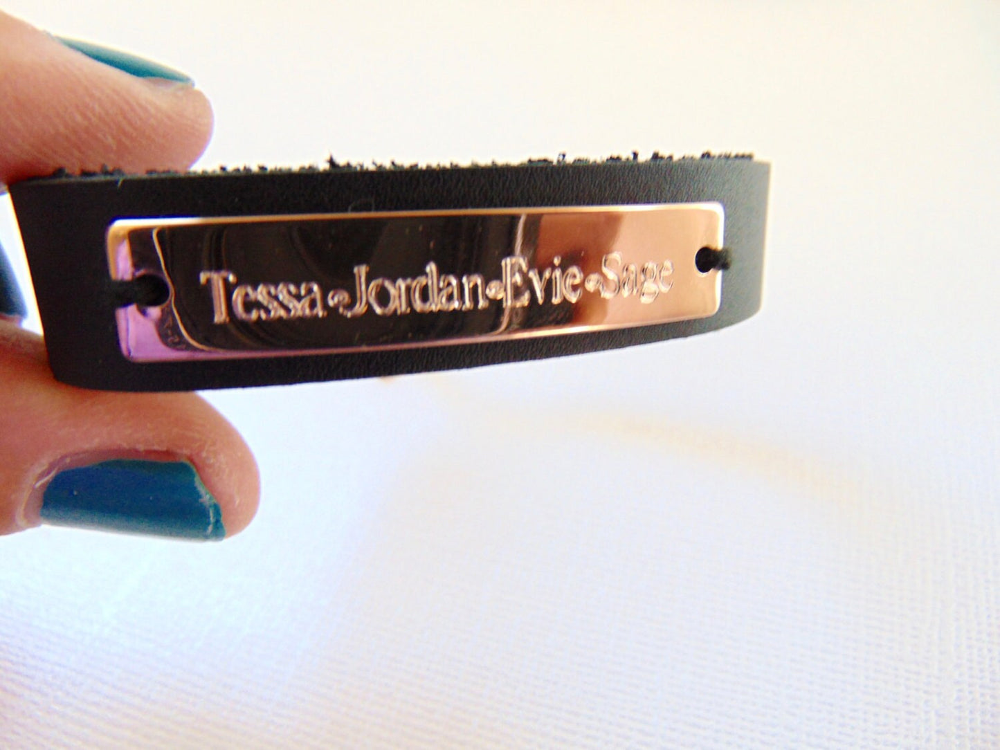 Customized engraving on rose gold cuff bracelet with black/brown leather