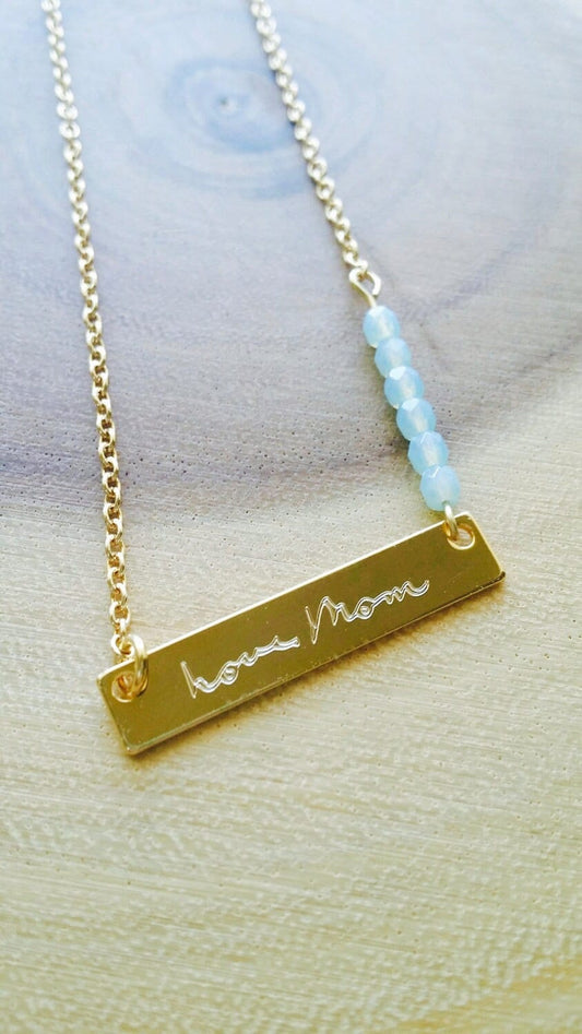 Custom handwriting engraved on gold bar necklace