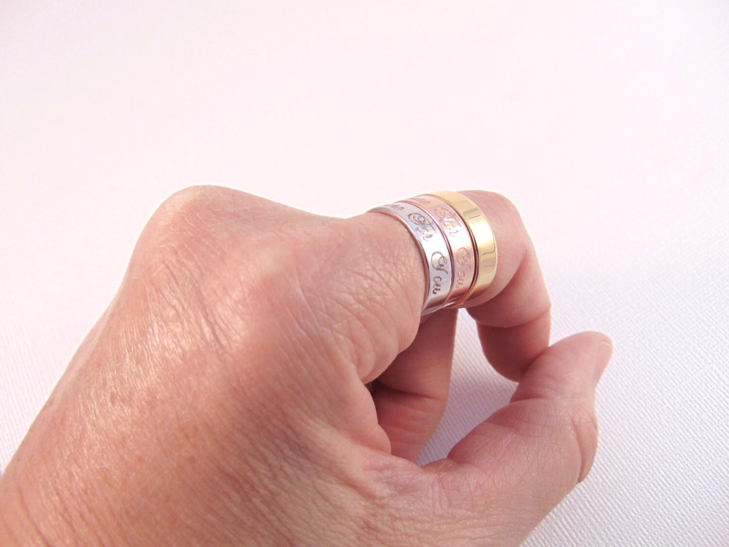 Stackable ring engraved with Child's Name or message. Adjustable band